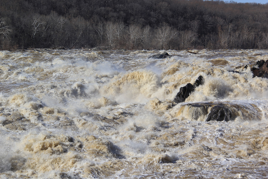 The Potomac River assaults the rocks before it reaches Great Falls.