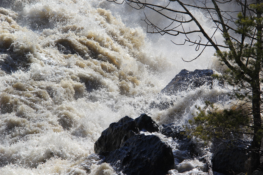 The power of the river crashes through the implacable rocks.